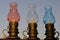 Ramadan lanterns Fanoos oil lamps with blurred background of the sunrise with the sky and the city.