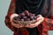 Ramadan tradition Muslim woman with plate of sweet dates during iftar