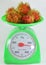 Rambutan on green weighting scale