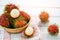Rambutan peeled in a basket on table background - Fresh rambutan summer fruit from garden in Thailand