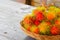 Rambutans fruit in basket on a wood desk background