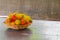 Rambutans fruit in basket on a wood desk background