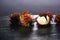 Rambutans fruit with leaf on table. Rambutan or hairy lychee