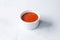ramekin condiment cup of red shatta, bowl