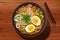 Ramen in a bowl top view. Ramen soup with egg and green onions. Generative AI