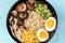 Ramen close-up. Soba with eggs, mushrooms, and vegetables, shot from above