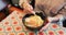 Ramen food, plate and table in restaurant with person, hands and ginger with closeup for Japanese cuisine. Niboshi bowl