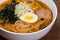 Ramen miso of Meat with pork, soy milk, pork broth,.black mushrooms, eggs, onions, corn, carrots and courgettes
