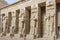 Ramessid statues and columns in the first courtyard of Mortuary Temple of Ramesses III
