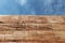 Rammed earth wall material texture on sky background