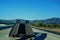 Ramp of a car carrier truck driving down the freeway.