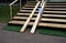 Ramp combined with a wooden staircase and a handrail specially adapted for wheelchairs. security tasteful solution for entering a