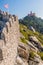 Ramparts of the Castelo dos Mouros castle in Sintra with Pena Palace (Palacio da Pena) in the background, Portug