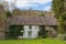 Ramshackle derelict rural cottage overgrown and left abandoned