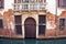 Ramshackle door of typical Venice residential house. Italy