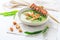 Ramson or bear leek soup with crouton, sour cream and turkey skewer