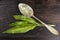 Ramson leafs with vintage spoon on dark wooden table