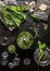 Ramson, wild garlic, pesto in blender on dark rustic kitchen table background with ingredients, top view. Healthy cooking still