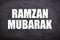 Ramzan Mubarak text with blackboard background for Muslims.
