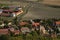 Rana, Czech republic - September 16, 2018: houses and trees of Rana village with Kostel Vsech Svatych church viewed from Rana hill