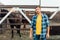 Rancher in shirt standing near corral