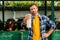 Rancher in shirt standing near cowshed