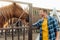 Rancher in shirt touching head of