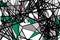 Random chaotic straight black lines. Abstract geometric pattern. Gray, green, red fragments of a complex structure