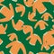 Random orange sweater knitted clothes seamless pattern. Green bright background.