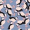Random seamless pattern with arctic bird puffin silhouettes. Blue background. Cartoon animal backdrop