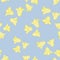 Random yellow campanula wildflower shapes seamless nature pattern. Pastel blue background