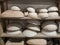 Range of pottery molds on a wooden shelf in potters studio. For