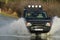 Range Rover driving through floodwaters UK