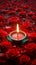 Rangoli elegance red rose floral design with a lit diya