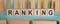 RANKING word written on wooden blocks on light blue background