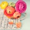 Ranunculus flower on a wicker tray