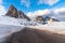 Raod in snwy mountain scenery in the Eutopean Alps and blue sky