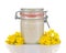 Rapeseed honey in a glass jar isolated.