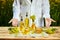 Rapeseed oil bottle in hand of an agronomist or biologist on background rape field