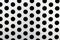 Rapid black big dot pattern on white background, round holes texture on perforated metal panel surface, close-up.