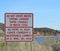 Rapid Changes in Water Level and Do Not Enter the Water sign overlooking the Colorado River in Laughlin, Clark County, Nevada USA