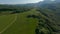 Rapid flight rotation aerial shot epic nature valley landscape with mountain hilly terrain blue sky