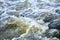 The rapid flow of river water