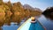 Rapid river boat trip with rocky mountains in background slow motion