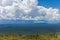 Rapidly approaching a tropical rainstorm passes through the rain forest