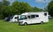 : Rapido Motorhome and Caravan - Trailer parked on country campsite.