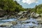 Rapids and large volcanic boulders line the course of the Alcantara river near Taormina, Sicily