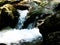 Rapids in the wild brook with boulders in the water 2