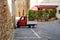 Rapolano Terme, Tuscany, Italy. Ape PIaggio red parked in the old town