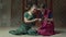 Rapting women in hindu sari looking at jewelry box